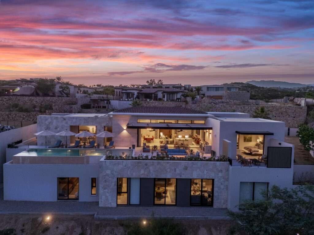 Querencia Section 18- Horizontes Welcome to Horizontes 3, an exquisite custom-made home located within San José del Cabo's most sought-after community, Querencia. Surrounded by Tom Fazio's signature golf course, recognized as one of the best in the country, this stunning residence is just a short golf cart ride from the prestigious 5-star Club House.This remarkable 6-bedroom, 6.5-bathroom home elevates luxury living with a fresh vision of architecture and design. The layout features a cozy family room, an expansive bunk bed bedroom on the lower level, and a spacious maid's quarters with an independent entrance, making it ideal for entertaining family and friends. The property boasts expansive outdoor living spaces, including tranquil green areas, an outdoor kitchen, an infinity pool, a jacuzzi, and breathtaking mountain – Querencia, San Jose Corridor, BS