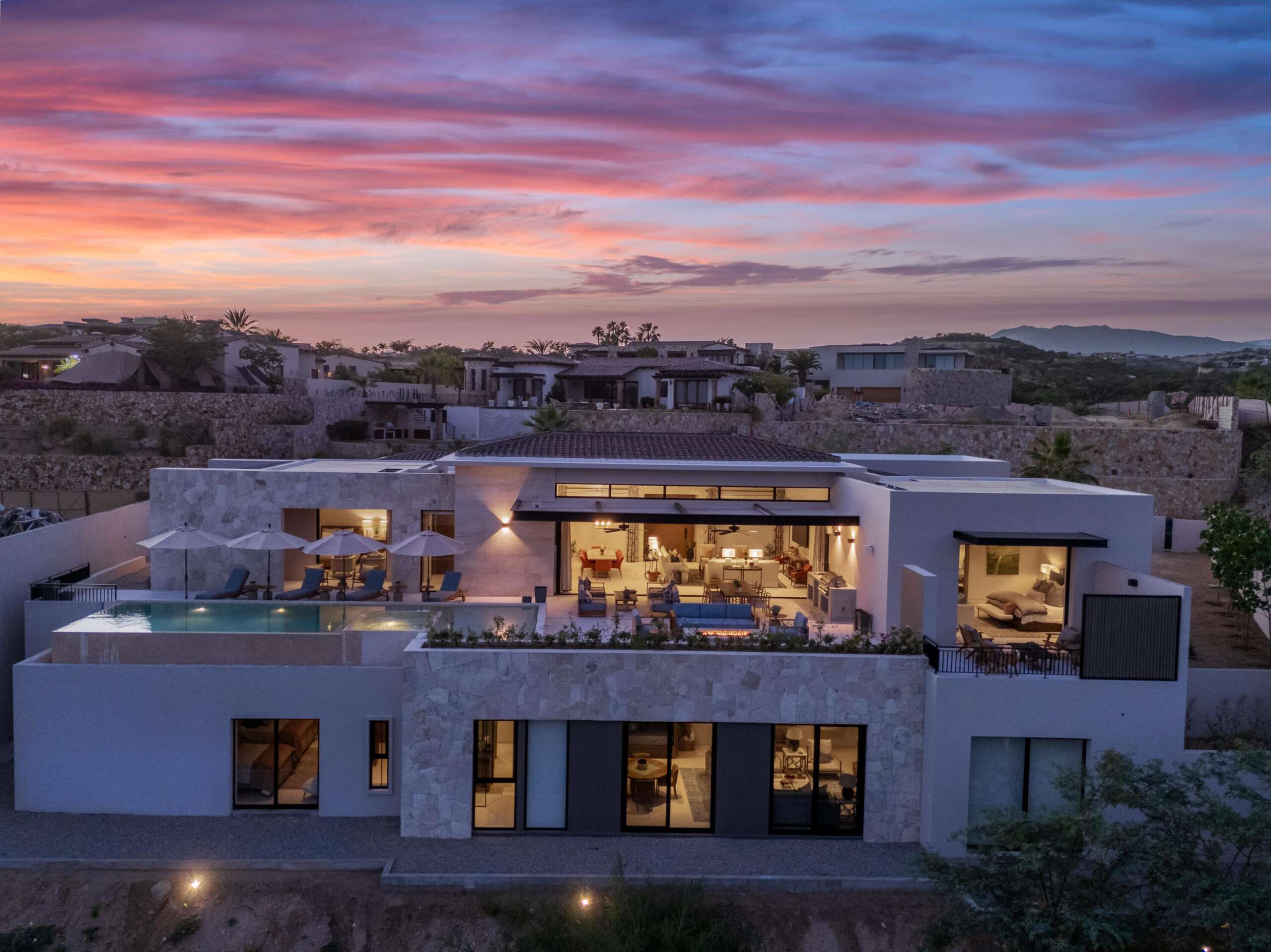 Querencia Section 18- Horizontes Welcome to Horizontes 3, an exquisite custom-made home located within San José del Cabo's most sought-after community, Querencia. Surrounded by Tom Fazio's signature golf course, recognized as one of the best in the country, this stunning residence is just a short golf cart ride from the prestigious 5-star Club House. This remarkable 6-bedroom, 6.5-bathroom home elevates luxury living with a fresh vision of architecture and design. The layout features a cozy family room, an expansive bunk bed bedroom on the lower level, and a spacious maid's quarters with an independent entrance, making it ideal for entertaining family and friends.The property boasts outdoor living spaces, including tranquil green areas, an outdoor kitchen, an infinity pool, a jacuzzi, and ocean and ravine – 3 Querencia, San Jose Corridor, BS