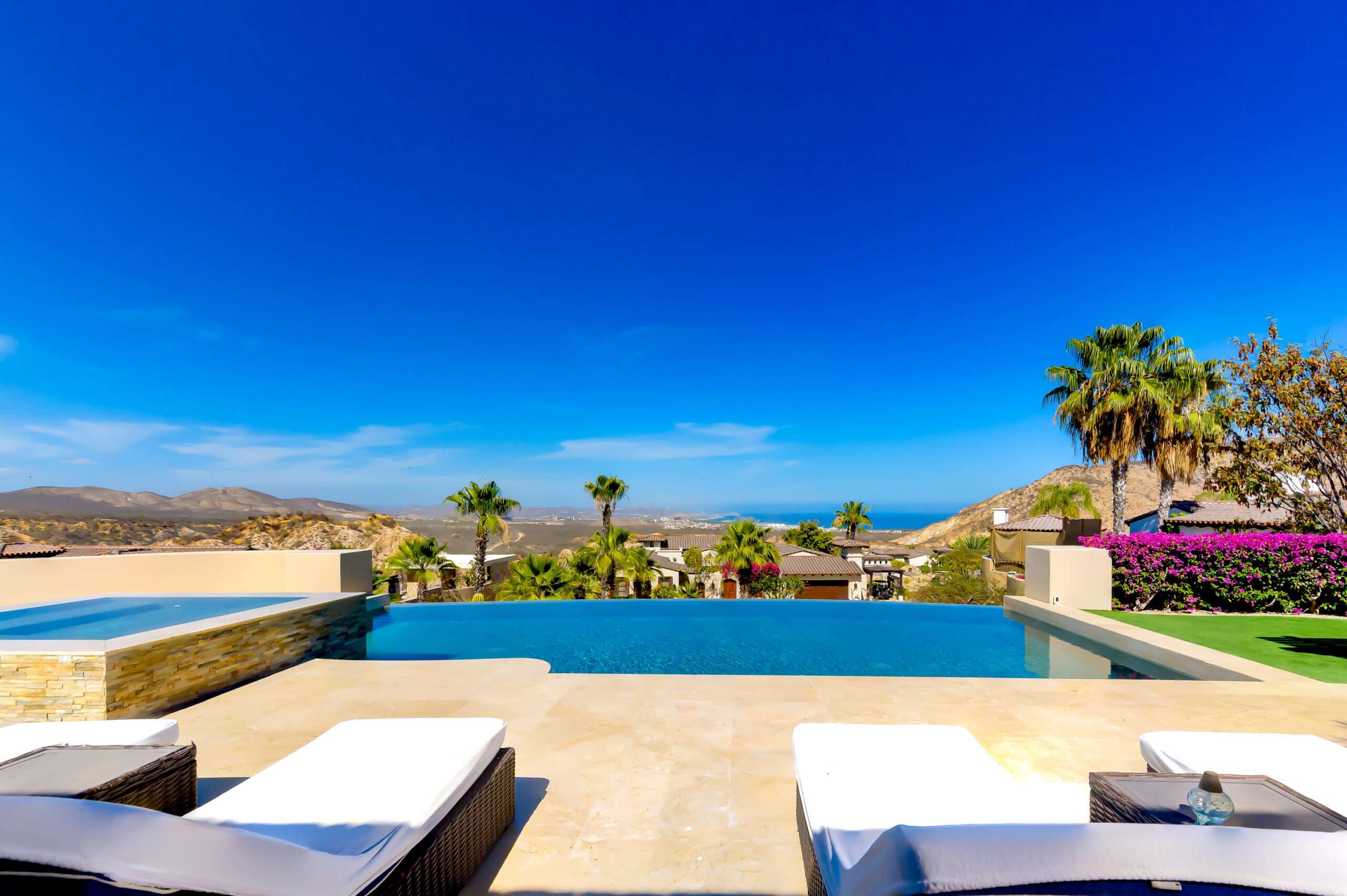 Querencia Section 18- Horizontes Welcome to Horizontes 3, an exquisite custom-made home located within San José del Cabo's most sought-after community, Querencia. Surrounded by Tom Fazio's signature golf course, recognized as one of the best in the country, this stunning residence is just a short golf cart ride from the prestigious 5-star Club House. This remarkable 6-bedroom, 6.5-bathroom home elevates luxury living with a fresh vision of architecture and design. The layout features a cozy family room, an expansive bunk bed bedroom on the lower level, and a spacious maid's quarters with an independent entrance, making it ideal for entertaining family and friends.The property boasts outdoor living spaces, including tranquil green areas, an outdoor kitchen, an infinity pool, a jacuzzi, and ocean and ravine for sale